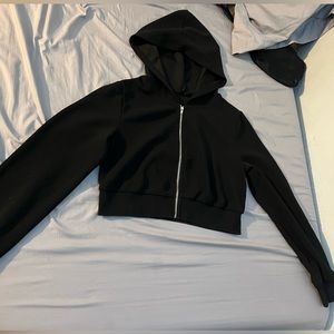 Black hooded crop top jacket.
